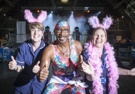 FREE TO USE PICTURE BY CHRIS BULL FOR ST ANN'S HOSPICE  19/6/15 - 20/6/15
St Ann's Hospice Midnight Walk through Manchester on Friday night.
St Ann's Little Hulton nurses Sarah McDonnell (left) and Kelly Keane with Mr Motivator.