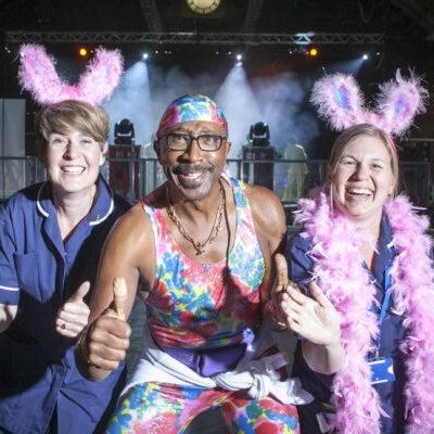 FREE TO USE PICTURE BY CHRIS BULL FOR ST ANN'S HOSPICE  19/6/15 - 20/6/15
St Ann's Hospice Midnight Walk through Manchester on Friday night.
St Ann's Little Hulton nurses Sarah McDonnell (left) and Kelly Keane with Mr Motivator.